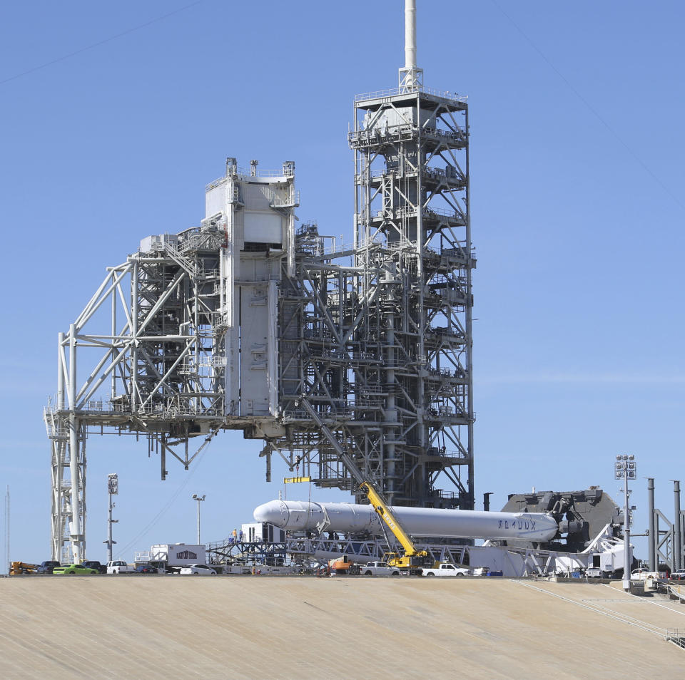 A Space X Falcon9 rocket is readied for launch Friday, Feb. 17, 2017, at Launch Complex 39A at the Kennedy Space Center in Cape Canaveral, Fla. Saturday morning's planned launch will be SpaceX's first from Florida since a rocket explosion at another pad last summer. (Red Huber/Orlando Sentinel via AP)