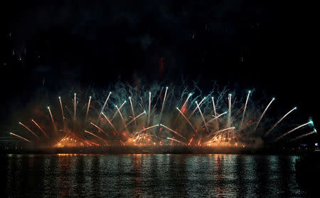 Fireworks explode along the Neva River, during the Scarlet Sails festivities marking school graduation, in St. Petersburg, Russia,June 24, 2018. REUTERS/Henry Romero