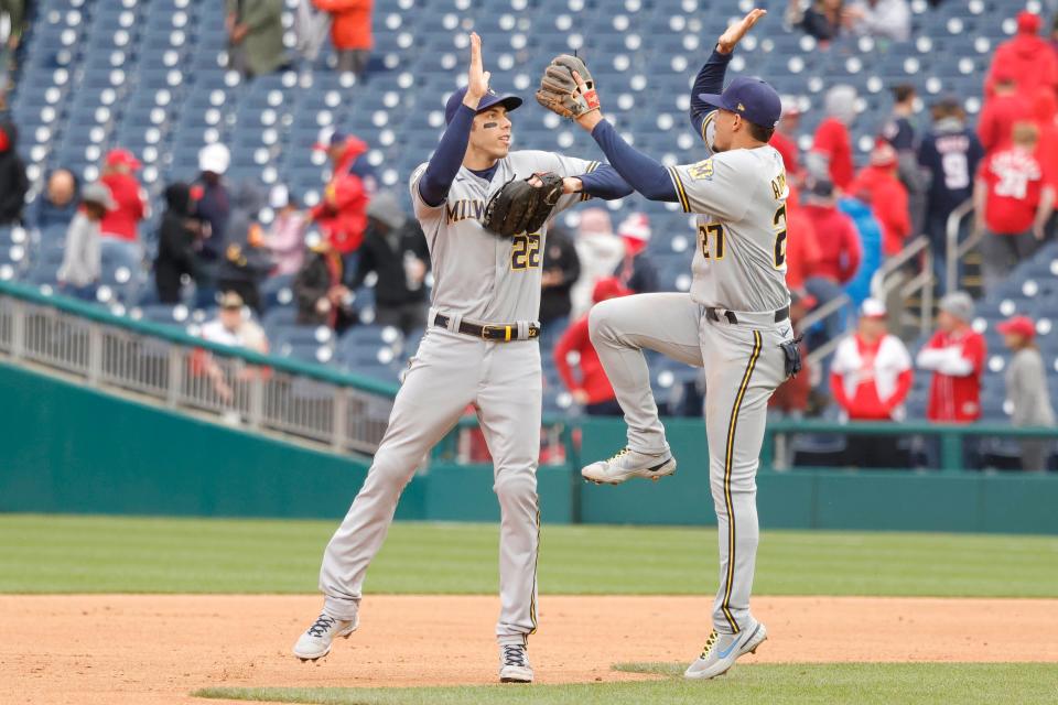 Brewers outfielder Christian Yelich and shortstop Willy Adames celebrate a win.