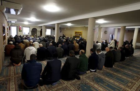 Members of the Muslim community attend the Friday prayer at Attadamoun Mosque in the neighbourhood of Molenbeek, in Brussels, Belgium, November 20, 2015. REUTERS/Youssef Boudlal