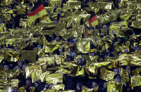 FILE - In this Tuesday, Nov. 19, 2019 filer, Germany's fans are seen before the Group C soccer qualifying match between Germany and Northern Ireland at the Commerzbank Arena in Frankfurt, Germany. For players, the pandemic has meant a congested season that poses fitness challenges, let alone trying to avoid coronavirus infections. Financially playing the delayed tournament is essential for UEFA. For fans, the EURO 2020 24-team event should be the first chance for the widespread return of fans to stadiums across Europe since March 2020, assuming new restrictions aren't imposed. (AP Photo/Michael Probst, File)