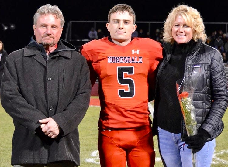 Honesdale senior safety Max Mickel (5) has been honored with selection to the Pennsylvania Football News Class 4A First Team All-State squad. Max is pictured here during Senior Night ceremonies with his Mom, Sarah, and Dad, Kyle.