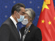 South Korean Foreign Minister Kang Kyung-wha, right, and Chinese Foreign Minister Wang Yi, arrive for their meeting at the foreign ministry in Seoul, South Korea, Thursday, Nov. 26, 2020. Wang arrived in Seoul on Nov. 25, for a three-day state visit.(Kim Min-hee/Pool Photo via AP)