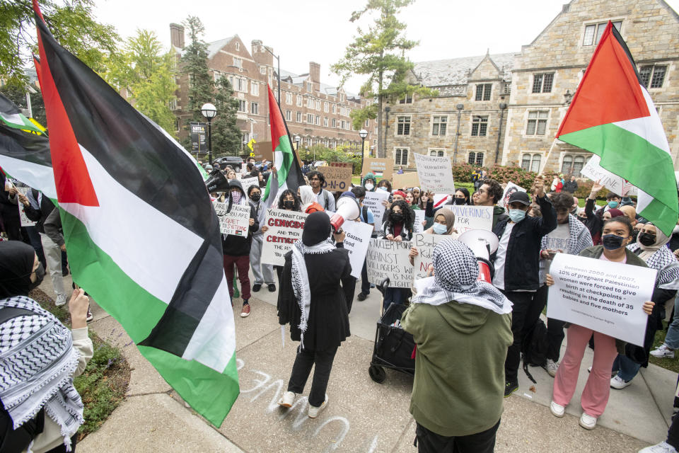 FILE - Pro-Palestinian demonstrators gather to protest University of Michigan President Santa Ono's "Statement regarding Mideast violence" outside the school President's House, Oct. 13, 2023, in Ann Arbor, Mich. The Ann Arbor Public Schools board is considering a resolution Wednesday, Jan. 17, 2024, calling for a cease-fire in the Israel-Hamas war while also encouraging its teachers to discuss the conflict in its classrooms. (Jacob Hamilton/Ann Arbor News via AP, File)