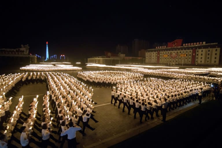 North Korea's torch parades are a unique spectacle, a display of formation marching and running and that requires strict discipline from the participants