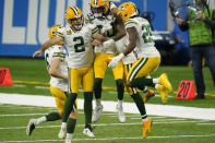 Green Bay Packers kicker Mason Crosby (2) celebrates his field goal with teammate during the second half of an NFL football game against the Detroit Lions, Sunday, Dec. 13, 2020, in Detroit. (AP Photo/Paul Sancya)