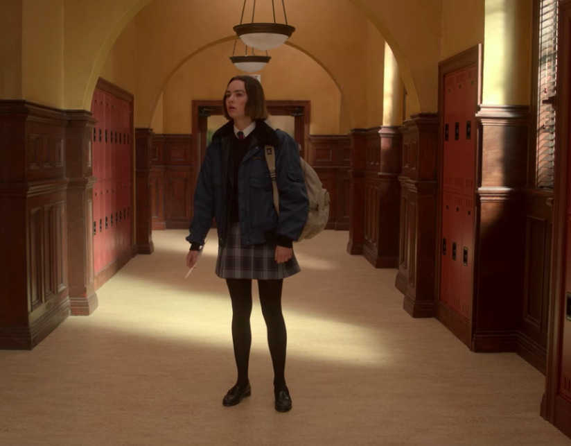 Casey standing in the middle of the hallway at her new school on "Atypical"