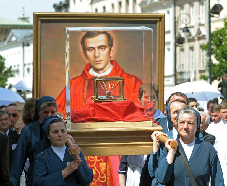 Nuns carry relics of Jerzy Popieluszko in Warsaw at a procession after his beatification mass in 2010. The dissident priest was a key figure in Poland's anti-communist movement and was abducted, tortured and murdered by secret police 30 years ago