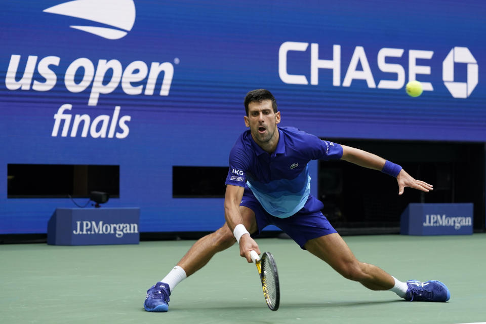 Novak Djokovic, of Serbia, returns a shot to Daniil Medvedev, of Russia, during the men's singles final of the US Open tennis championships, Sunday, Sept. 12, 2021, in New York. (AP Photo/Elise Amendola)