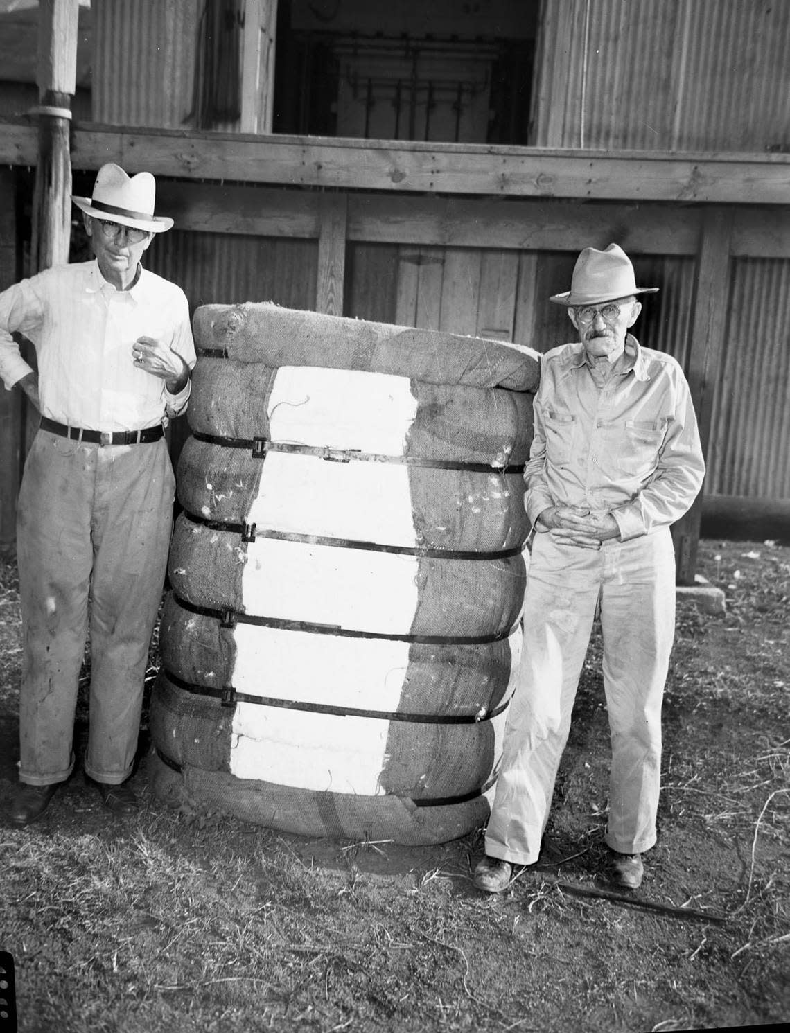 Aug. 19, 1942: Tarrant County’s first bale of cotton. C. G. Emmons, left, Keller gin operator, and J.W. Finney. Fort Worth Star-Telegram archive/UT Arlington Special Collections