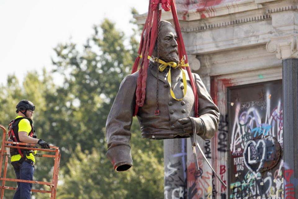 <div class="inline-image__caption"><p>The top half of the statue of former Confederate General Robert E. Lee is lifted away after being cut off and removed from Monument Avenue in Richmond, Virginia on Sept. 8, 2021.</p></div> <div class="inline-image__credit">Ryan M. Kelly/AFP via Getty Images</div>