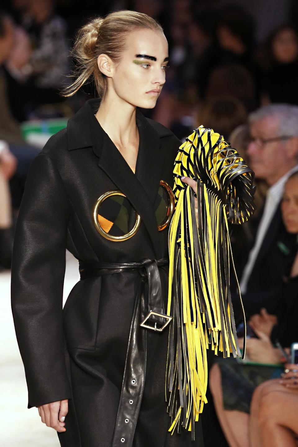 A model presents a creation as part of Celine's ready-to-wear Spring/Summer 2014 fashion collection, presented Sunday, Sept. 29, 2013 in Paris. (AP Photo/Jacques Brinon)