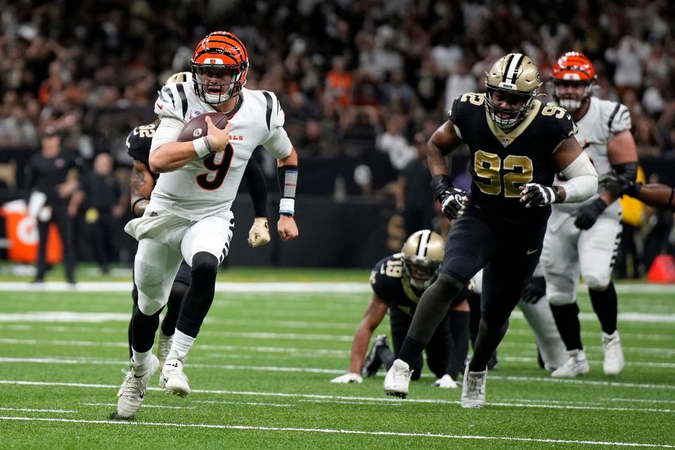 Cincinnati Bengals quarterback Joe Burrow (9) runs for a touchdown in the second quarter during an NFL Week 6 game against the New Orleans Saints, Wednesday, Oct. 6, 2021, at Mercedes-Benz Superdome in New Orleans.