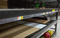 Supermarket shelves which contained bottled water stand empty as residents stock up on drinking water across Kanawha County (W.Va.) in Charleston, W.Va. on Saturday, Jan. 11, 2014. Coal processing chemicals from Freedom Industries spilled into the Elk River on Thursday. A handful of people have been hospitalized since the spill. Residents were asked to use their water only for flushing toilets. The West Virginia National Guard was sent to distribute fresh water in the area. (AP Photo Michael Switzer)