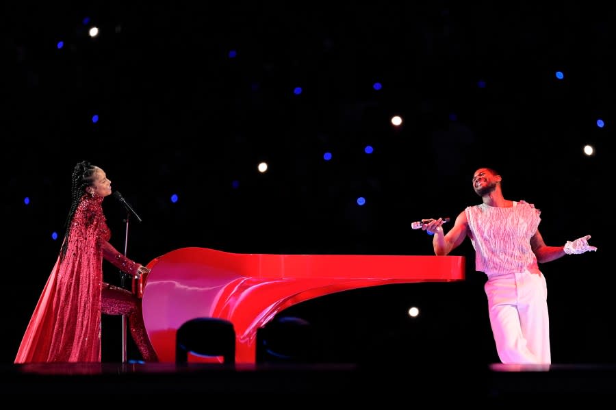 Alicia Keys, left, and Usher perform during halftime of the NFL Super Bowl 58 football game between the San Francisco 49ers and the Kansas City Chiefs Sunday, Feb. 11, 2024, in Las Vegas. (AP Photo/Eric Gay)