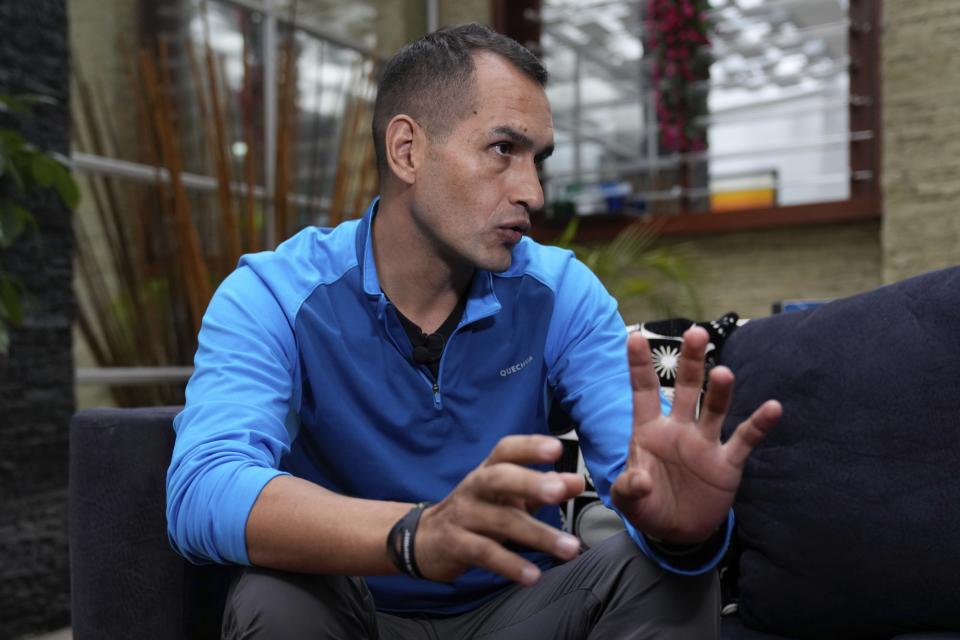 Colombian First Vice Sgt. Juan Carlos Rojas Sisa, one of the searchers looking for four Indigenous children who survived an Amazon plane crash, gives an interview in Bogota, Colombia, Wednesday, June 14, 2023. The children braved the jungle for 40 days before being found alive. (AP Photo/Fernando Vergara)