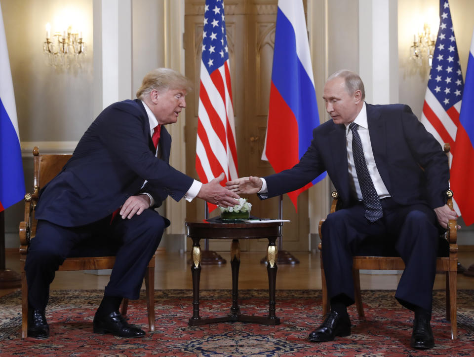 <p>U.S. President Donald Trump, left, and Russian President Vladimir Putin shake hand at the beginning of a meeting at the Presidential Palace in Helsinki, Finland, July 16, 2018. (Photo: Pablo Martinez Monsivais/AP) </p>