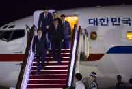 South Korean National Security Advisor Chung Eui-yong, bottom left, National Intelligence Service Director Suh Hoon, bottom second from left, and other delegates return from North Korea at Seoul Airport in Seongnam, South Korea, Wednesday, Sept. 5, 2018. A South Korean delegation met with North Korean leader Kim Jong Un on Wednesday during a visit to arrange an inter-Korean summit planned for this month and help rescue faltering nuclear diplomacy between Washington and Pyongyang.(Yun Dong-jin/Yonhap via AP)