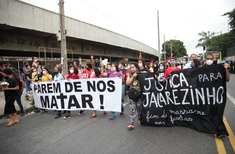 People protest against police violence outside Jacarezinho slum after a police operation which resulted in 25 deaths in Rio de Janeiro