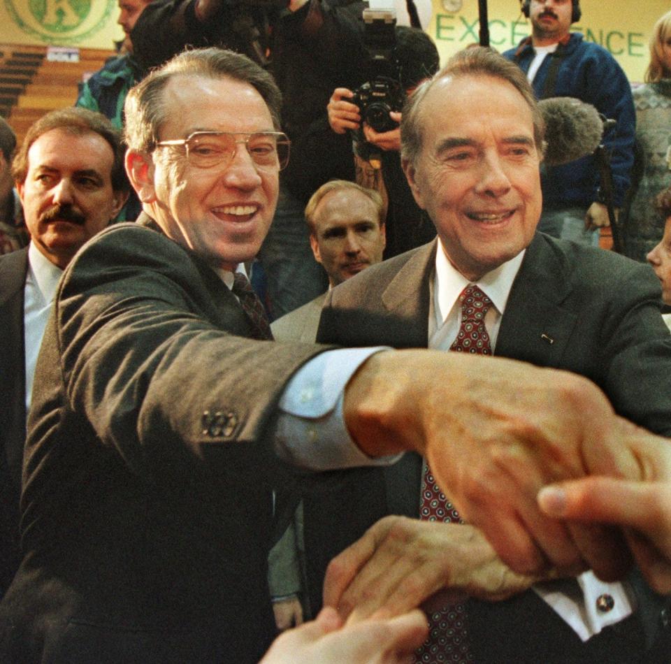 Iowa Sen. Chuck Grassley, left, campaigns with Bob Dole at a Dole for President rally at Kennedy High School in Cedar Rapids on Feb. 11, 1996.