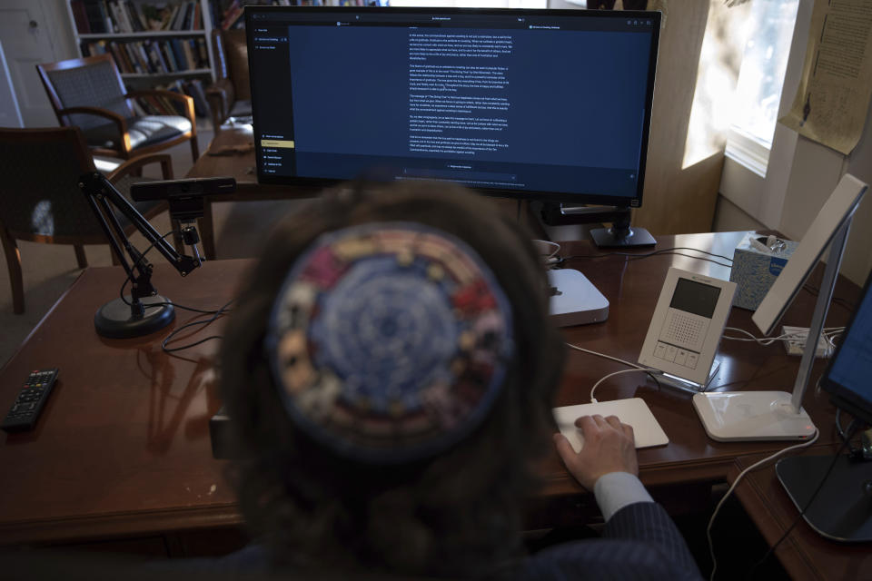 Rabbi Joshua Franklin uses artificial intelligence program Chat GPT in his offce at the Jewish Center of the Hamptons in East Hampton, New York on Feb. 10, 2023. Franklin experimented with using the artificial intelligence program to write a sermon. (AP Photo/Robert Bumsted)