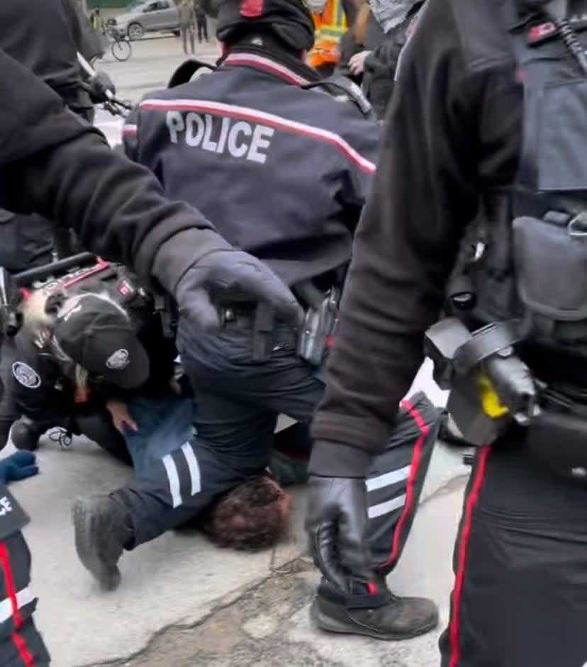 This screen grab from a video shared by the Toronto chapter of the Palestinian Youth Movement of the arrest at a Sunday protest in downtown Toronto was shared on social media Tuesday. (Pymtoronto/Instagram - image credit)