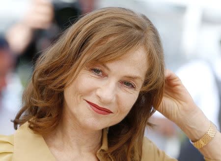 Cast member Isabelle Huppert poses during a photocall for the film "Elle" in competition at the 69th Cannes Film Festival in Cannes, France, May 21, 2016. REUTERS/Yves Herman