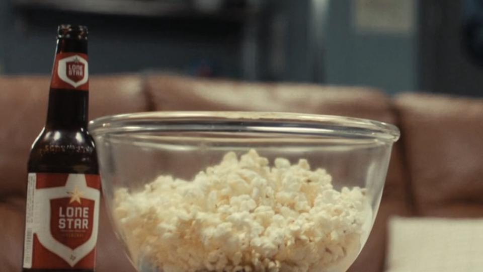 Lone Star beer bottle and popcorn in True Detective: Night Country