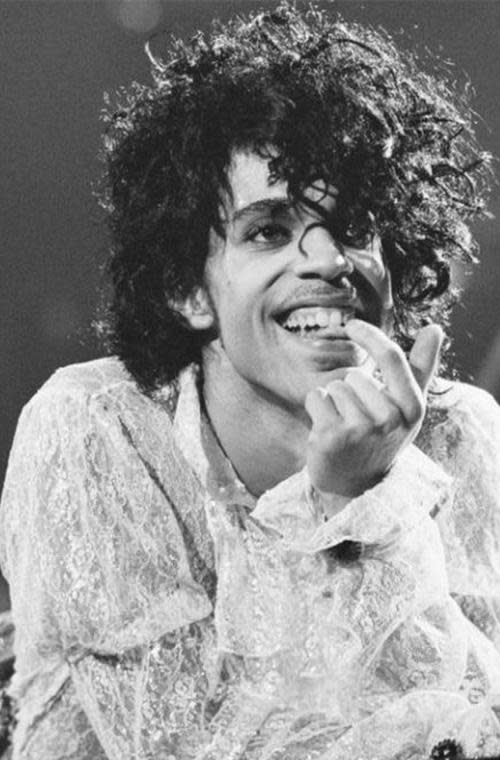 Prince's larger then life hair. Prince slayed it in white frilled lace at California's fabulous forum.