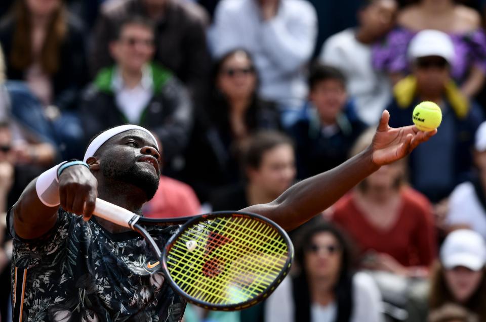Frances Tiafoe of the US serves the ball to Serbia's Filip Krajinovic during their men's singles first round match on day two of The Roland Garros 2019 French Open tennis tournament in Paris on May 27, 2019. (Photo by Philippe LOPEZ / AFP)        (Photo credit should read PHILIPPE LOPEZ/AFP/Getty Images)