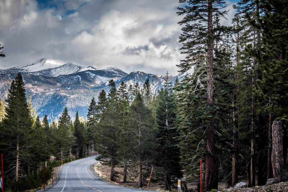 Looking down the road California State Route 203 in Mammoth Lakes, with the Sierra Nevada Mountains in the distance