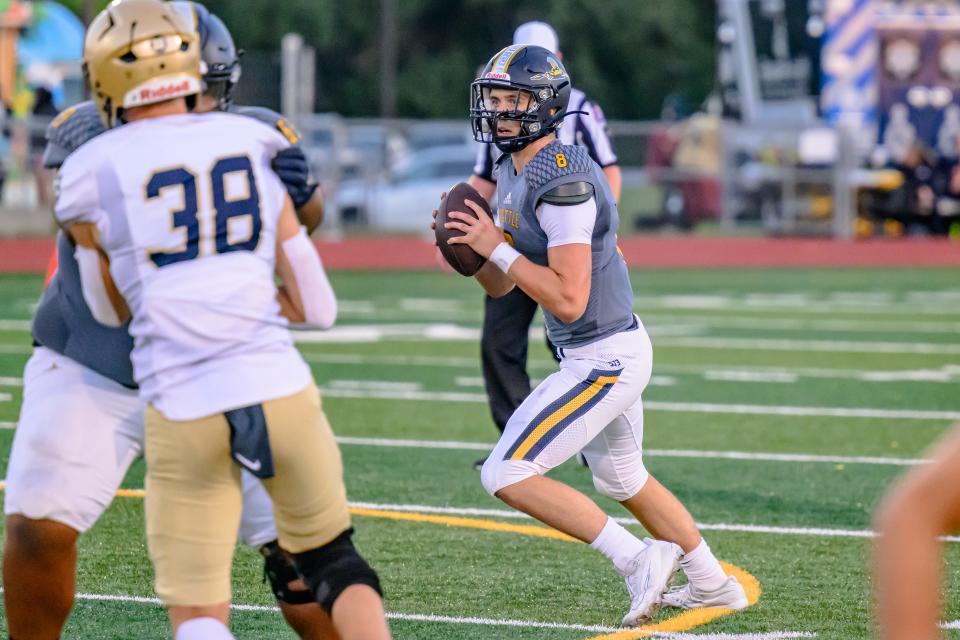 Battle's Alex Fernandez (8) looks downfield for the open receiver during a game against Helias at Battle High School on Sept. 8, 2023, in Columbia, Mo.