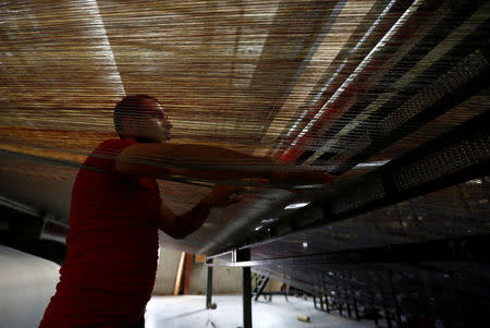 A employee works at Akkad's carpet factory in Jordan Industrial Estates Company in Al-Muwaqar south of Amman, Jordan, September 14, 2017. Picture taken September 14, 2017. REUTERS/Muhammad Hamed