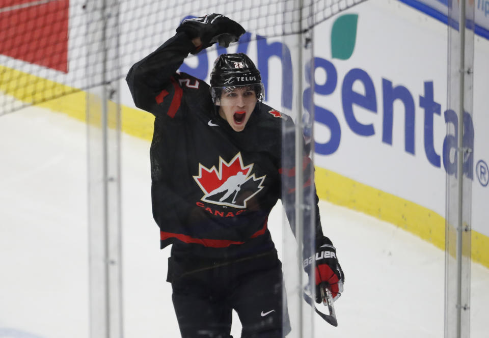 Canada's Dylan Cozens celebrates after scoring his sides first goal during the U20 Ice Hockey Worlds gold medal match between Canada and Russia in Ostrava, Czech Republic, Sunday, Jan. 5, 2020. (AP Photo/Petr David Josek)