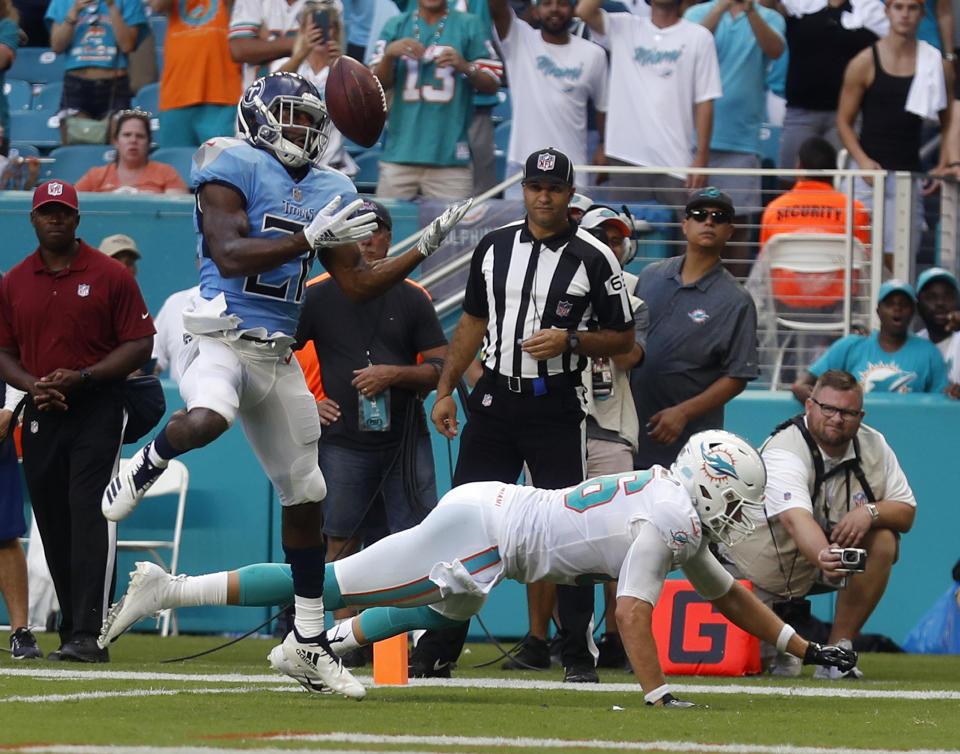 Tennessee Titans defensive back Malcolm Butler (21) intercepts a pass in the end zone intended for Miami Dolphins tight end Mike Gesicki (86), during the second half of an NFL football game, Sunday, Sept. 9, 2018, in Miami Gardens, Fla. (AP Photo/Brynn Anderson)