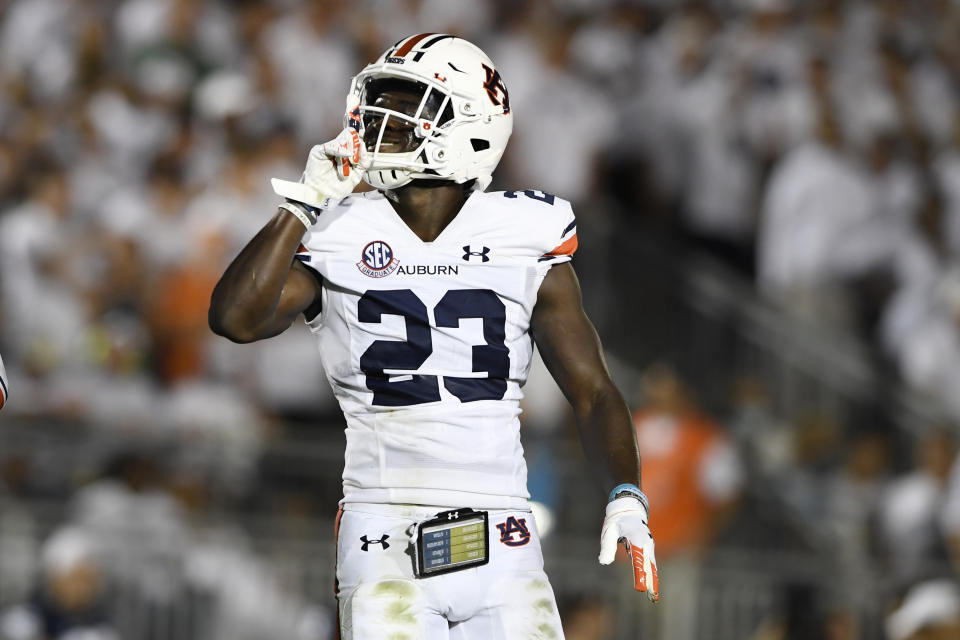 Auburn cornerback Roger McCreary (23) celebrates after intercepting Penn State quarterback Sean Clifford (14) during the first half of an NCAA college football game in State College, Pa., on Saturday, Sept. 18, 2021. (AP Photo/Barry Reeger)