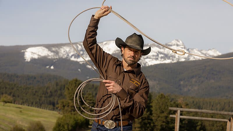 a man holding a lasso