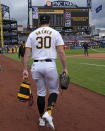 Pittsburgh Pirates starting pitcher Paul Skenes heads to the bullpen to warm up for his major league debut before a baseball game against the Chicago Cubs in Pittsburgh, Saturday, May 11, 2024. (AP Photo/Gene J. Puskar)