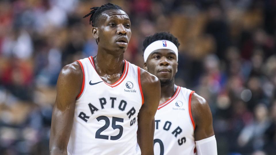 TORONTO, ONTARIO - OCTOBER 13: Chris Boucher #25 and Terence Davis #0 of the Toronto Raptors during a break agains the Chicago Bulls during their NBA basketball pre-season game at Scotiabank Arena on October 13, 2019 in Toronto, Canada. NOTE TO USER: User expressly acknowledges and agrees that, by downloading and or using this photograph, User is consenting to the terms and conditions of the Getty Images License Agreement. (Photo by Mark Blinch/Getty Images)