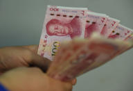 Los ciudadanos de China emplean billetes y monedas para pagar en el 40% de las compras que realizan. (Foto: Feature China / Barcroft Media / Getty Images).
