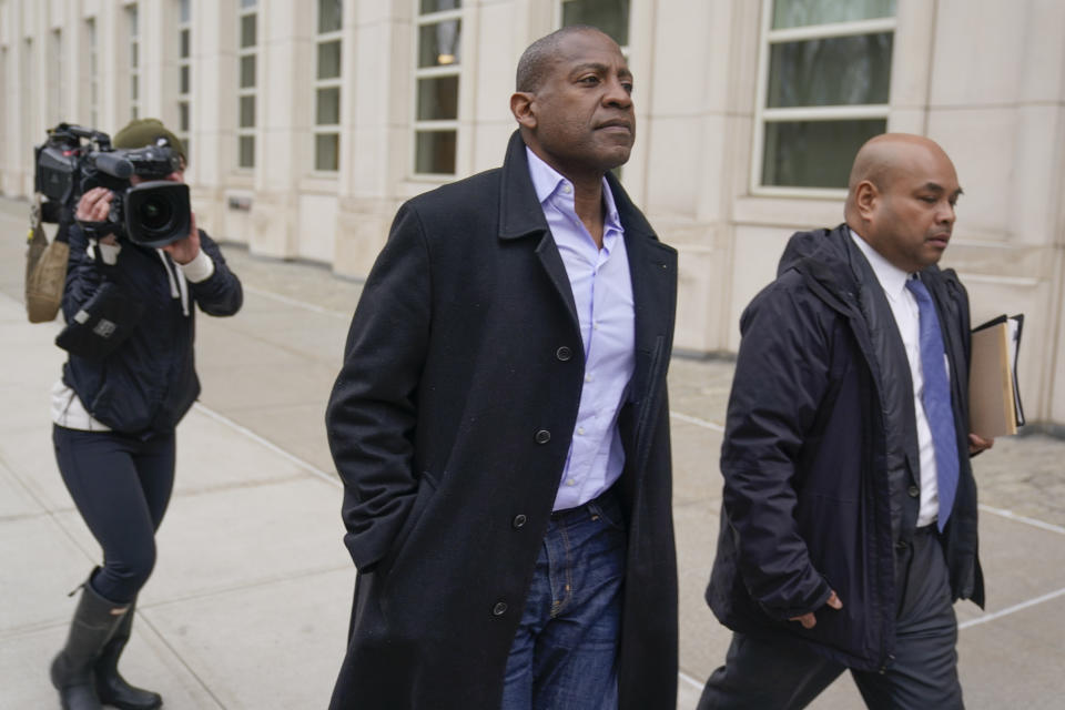 Carlos Watson, center, leaves Brooklyn federal court in New York, Thursday, Feb. 23, 2023. The founder of the troubled digital start-up Ozy Media has been arrested on fraud charges as part of what prosecutors say was a scheme to prop up the financially struggling company. (AP Photo/Seth Wenig)