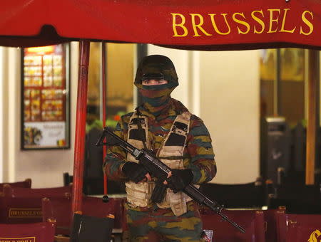 A Belgian soldier stands guard outside a cafe near Brussels' Grand Place on November 22, 2015, after security was tightened in Belgium following the fatal attacks in Paris. REUTERS/Yves Herman