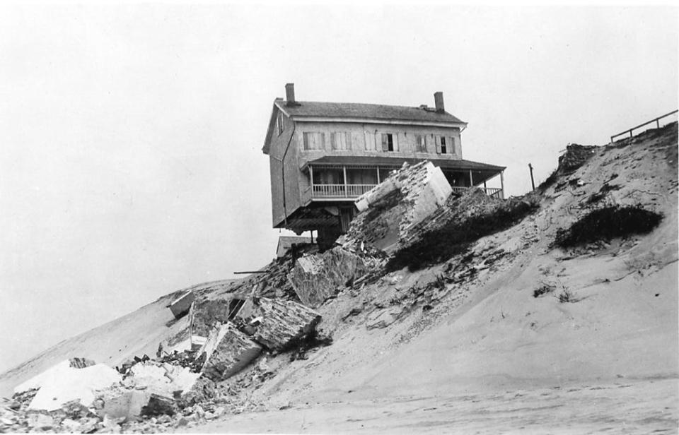 The view after the Cape Henlopen Light tower collapsed. The keeper's house rests on the edge of the dune on April 13, 1926.