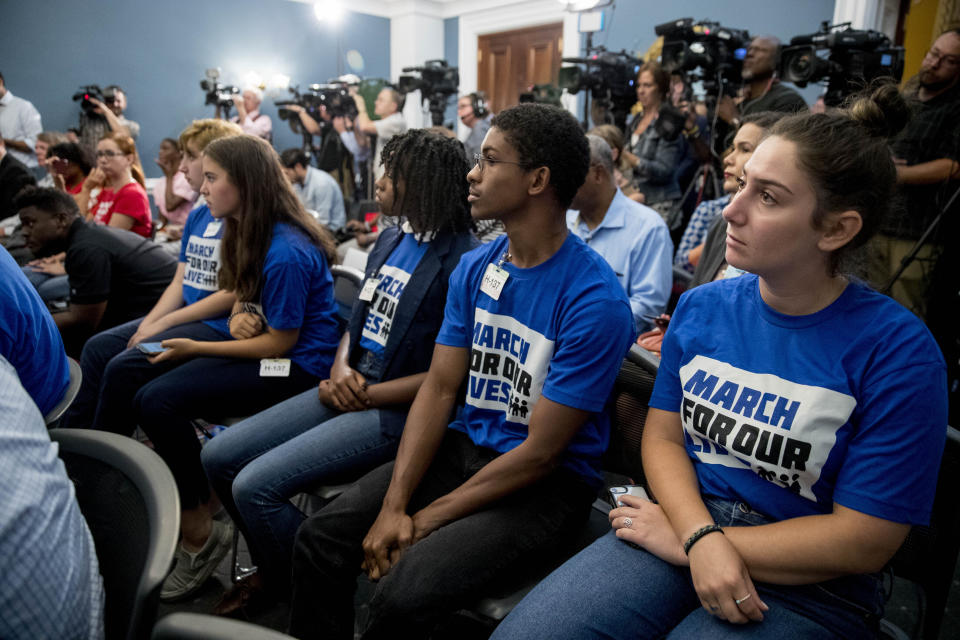 Members of the audience wear March For Our Lives shirts as House Majority Leader Steny Hoyer of Md., Rep. Debbie Dingell, D-Mich., Rep. Anthony Brown, D-Md., and others, hold a news conference calling for Senate action on H.R. 8 - Bipartisan Background Checks Act of 2019 on Capitol Hill in Washington, Tuesday, Aug. 13, 2019. (AP Photo/Andrew Harnik)