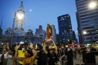 Protesters march past City Hall on Tuesday, June 2, 2020, in Philadelphia, over the death of George Floyd, who died after being restrained by Minneapolis police officers on May 25. (AP Photo/Matt Slocum)