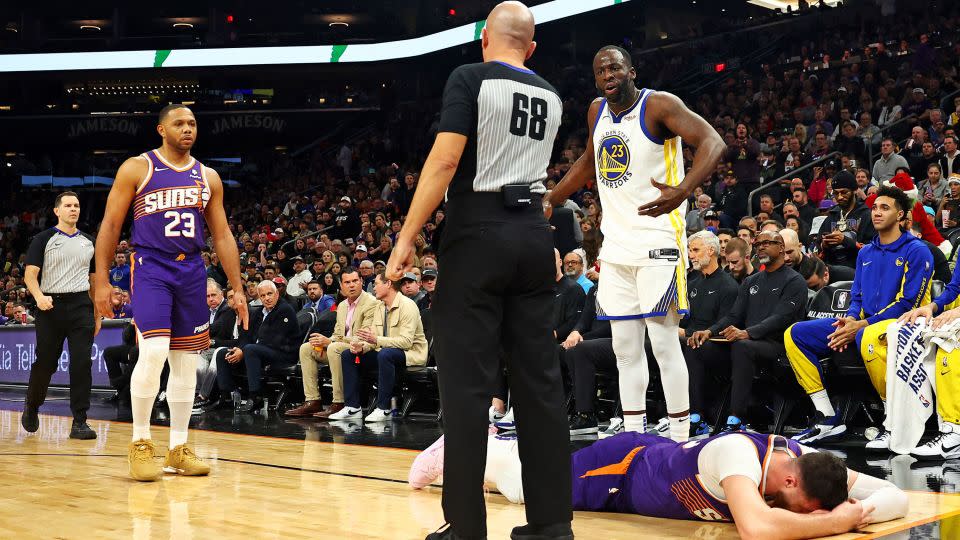 Nurkić lies on the ground hurt while Green reacts after being whistled for a foul. - Mark J. Rebilas/USA Today Sports via Reuters