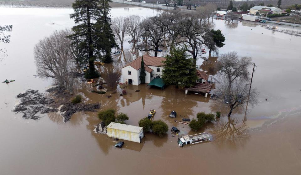 This aerial view shows a flooded home partially underwater in Gilroy, California, on January 9, 2023.