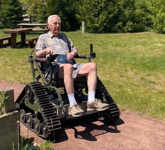 A senior citizen heads out onto the Family Discovery Trail  at The Ridges Sanctuary in Baileys Harbor this summer by making use of the nature preserve's new Action Trackchair. The sanctuary is making the chair available for free to people with mobility issues so they can go out and enjoy nature, as is Peninsula State Park with its newly acquired Trackchair.