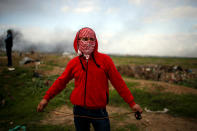 <p>A Palestinian protester holds a sling as he poses for a photograph at the scene of clashes with Israeli troops near the border with Israel, east of Gaza City, Jan. 19, 2018. ” I hope I can live my dreams, I always dreamt of a job and of freedom of movement,” he said. (Photo: Mohammed Salem/Reuters) </p>