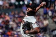 Jul 11, 2018; San Francisco, CA, USA; San Francisco Giants starting pitcher Dereck Rodriguez (57) pitches against the Chicago Cubs during the eleventh inning at AT&T Park. Mandatory Credit: Stan Szeto-USA TODAY Sports